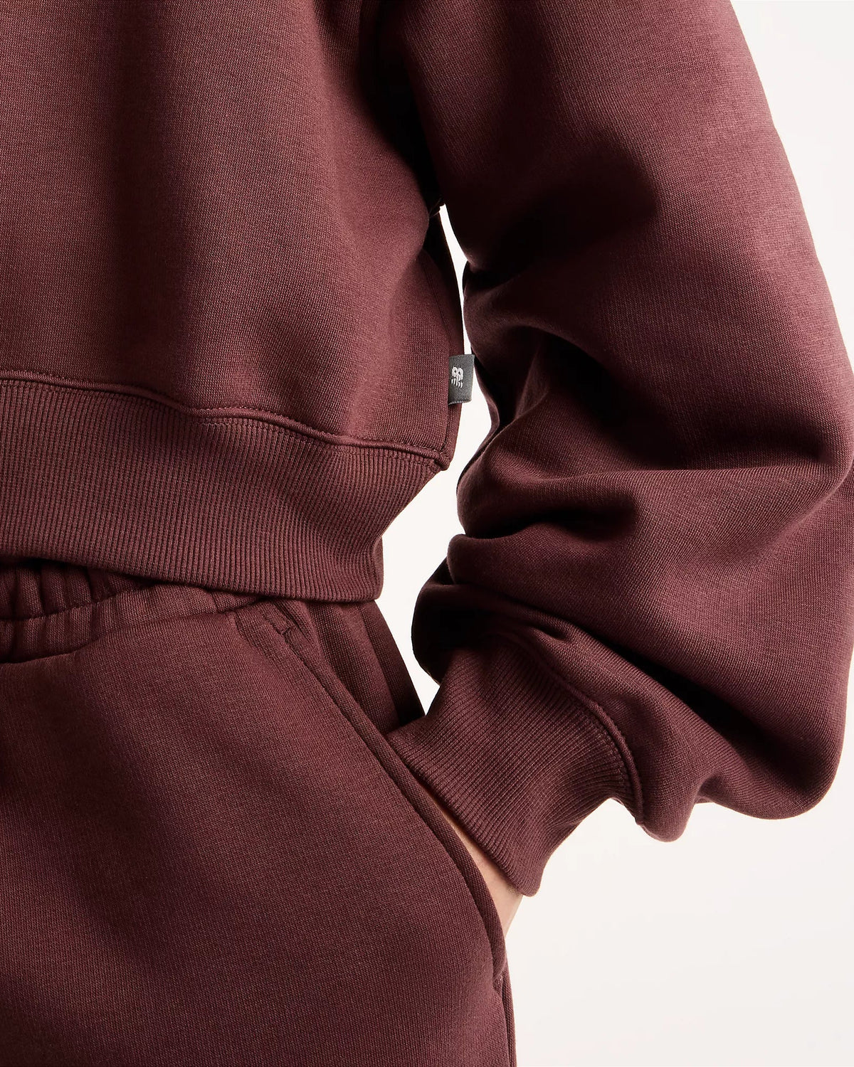 Camisola Mulher New Balance Trackside Fleece Crew Bordô New Balance