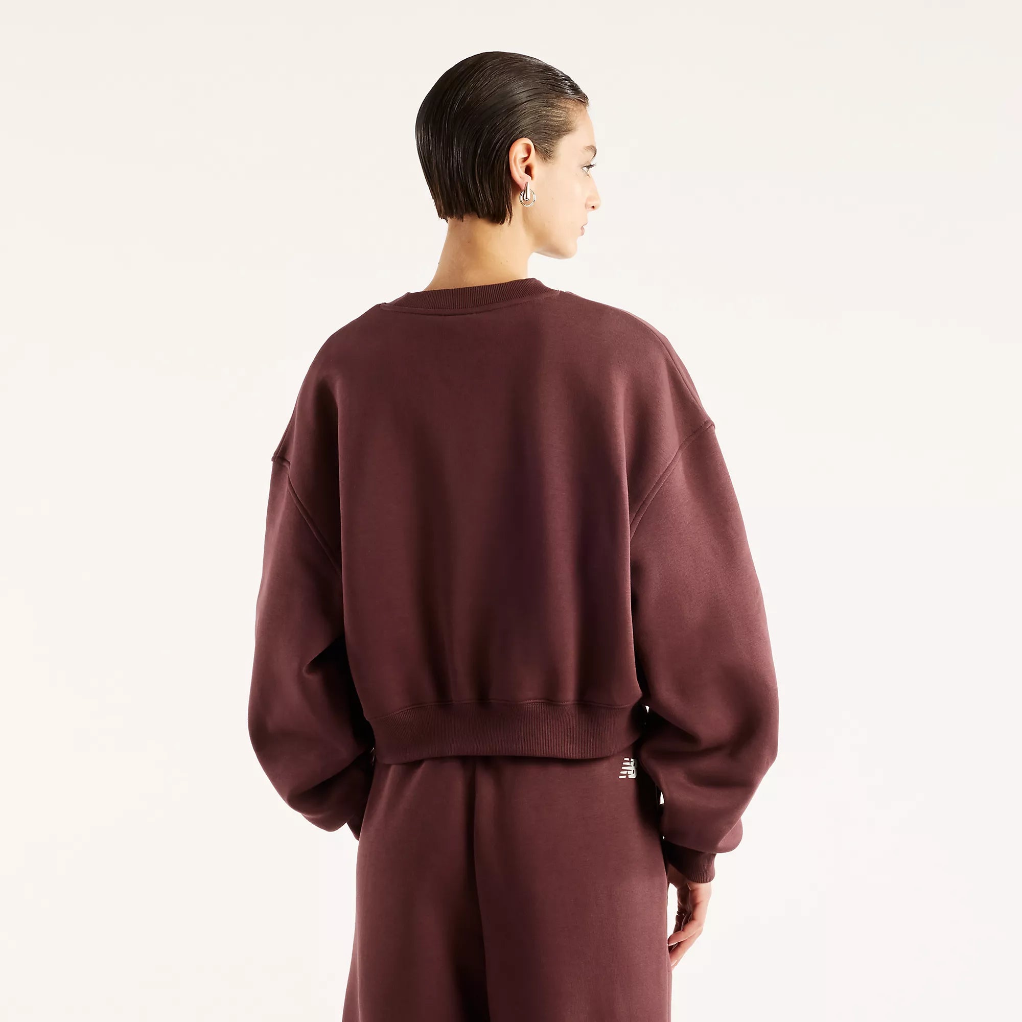 Camisola Mulher New Balance Trackside Fleece Crew Bordô New Balance 